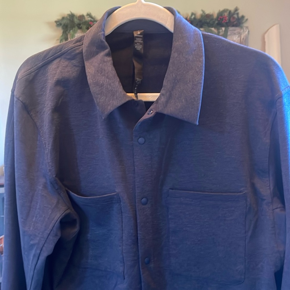 Men’s Lululemon blue button-down casual long sleeve shirt.